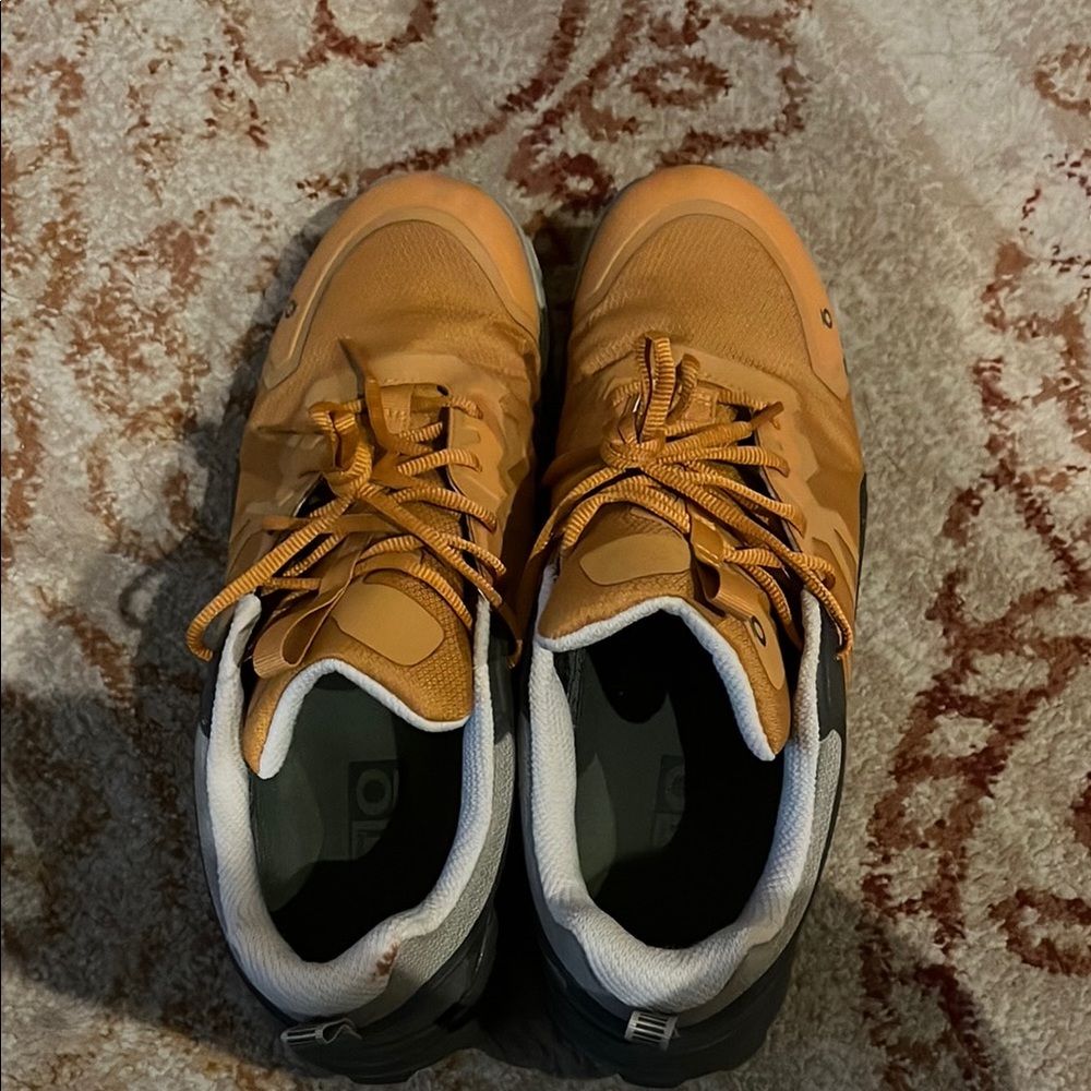 Orange hiking Shoes with Comfortable Fit and Stylish Design. Worn once. Like new